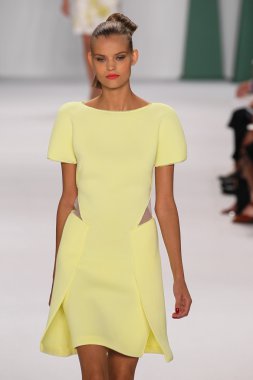 Model Kate Grigorieva walk the runway at the Carolina Herrera fashion show