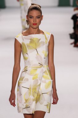 Model Martha Hunt walk the runway at the Carolina Herrera fashion show