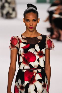 Model Cora Emmanuel walk the runway at the Carolina Herrera fashion show