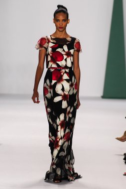 Model Cora Emmanuel walk the runway at the Carolina Herrera fashion show