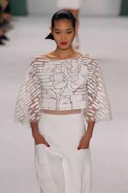 Model Chiharu Okunugi walk the runway at the Carolina Herrera fashion show