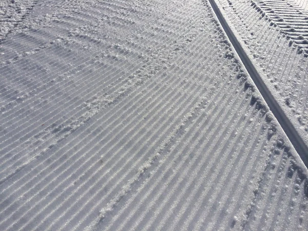 Fresh snow groomer tracks — Stock Photo, Image