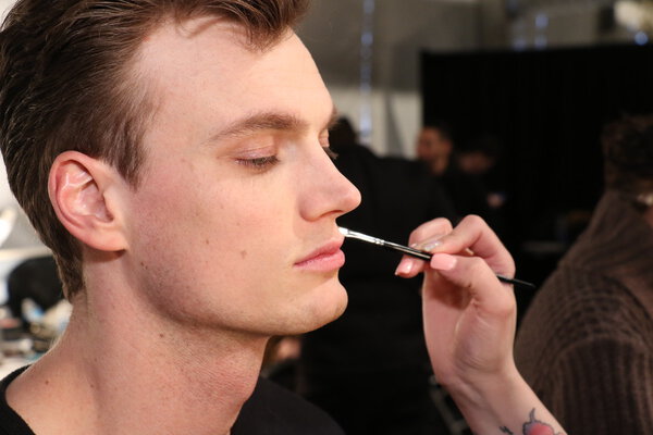 Model getting ready backstage at the SERGIO DAVILA fashion show