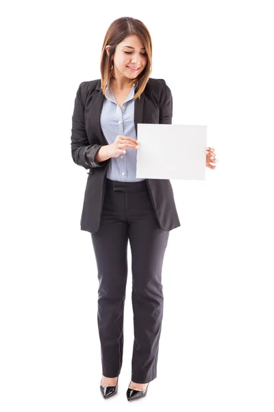 Businesswoman holding a sign — Stock Photo, Image