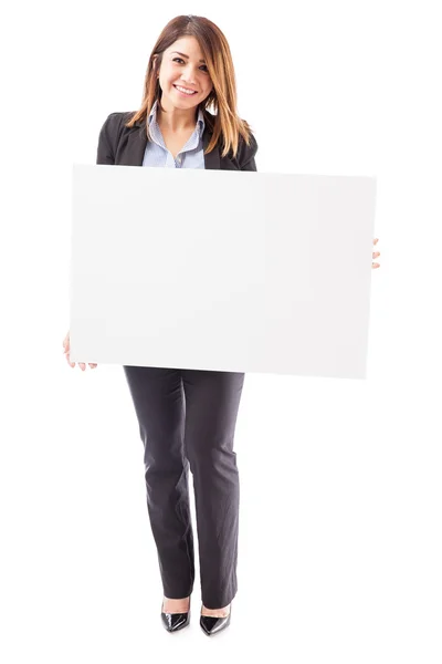 Business woman holding a big sign — стоковое фото