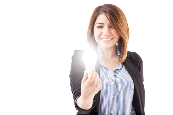 Businesswoman holding LED light bulb — Stock Photo, Image