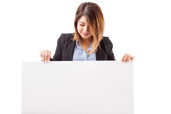 Executive holding a big sign — Stock Photo, Image