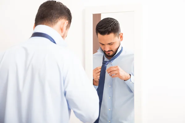 Man with a beard getting dressed — Stock Photo, Image