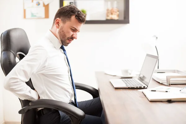 Businessman having back pain — Stock Photo, Image