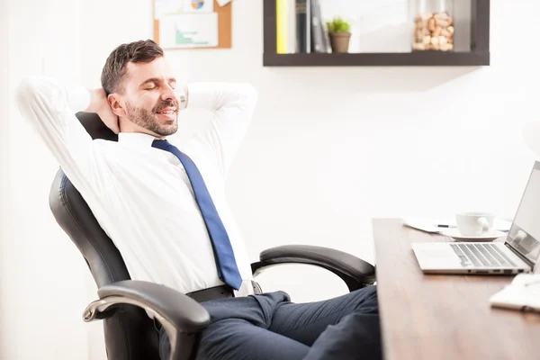 businessman leaning back on his chair
