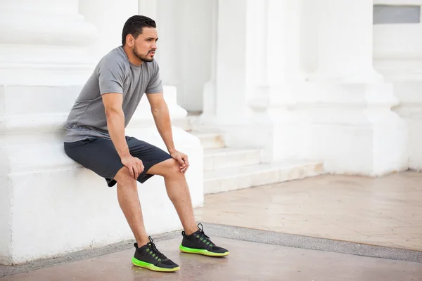 Man in sporty outfit taking a break — Stock Photo, Image