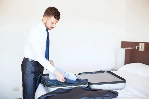 Businessman packing  suitcase — Stock Photo, Image