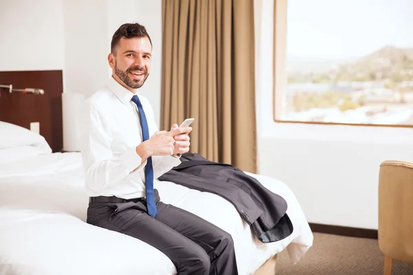 Manager checking his emails on a smartphone — Stock Photo, Image