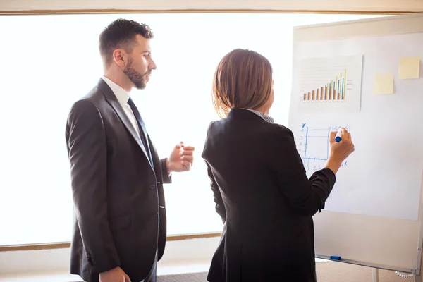 Business partners preparing a presentation — Stock Photo, Image