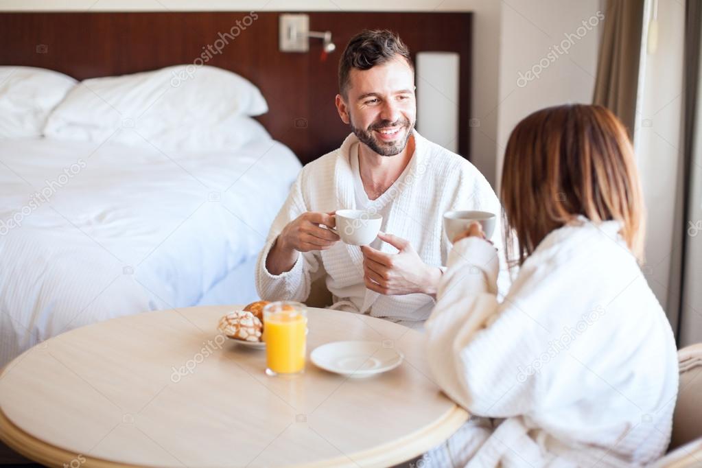 couple enjoying coffee and breakfast
