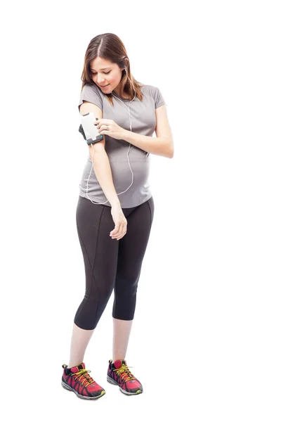 Pregnant woman playing some music — Stock Photo, Image