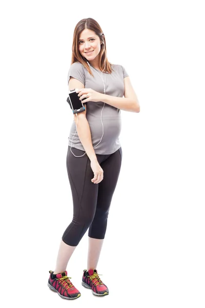 Woman listening to music with earbuds — Stock Photo, Image