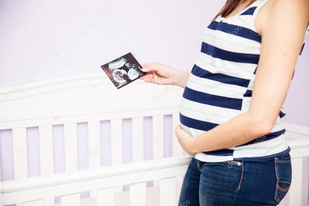 woman touching her belly 