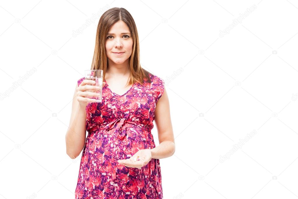  woman holding a bunch of pills
