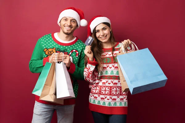 Attractive Hispanic Couple Carrying Some Shopping Bags Credit Card Some — Stock Photo, Image