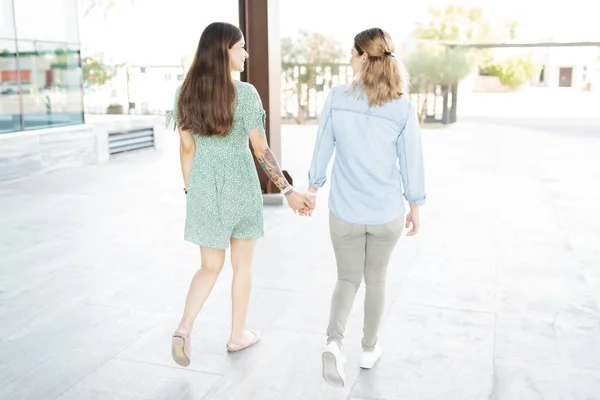 Rear View Multiracial Lesbian Couple Making Eye Contact Holding Hands — Stock Photo, Image