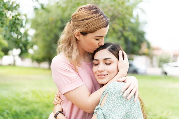 Caucasian Cute Young Woman Kissing Top Head Her Hispanic Girlfriend — Stock Photo, Image