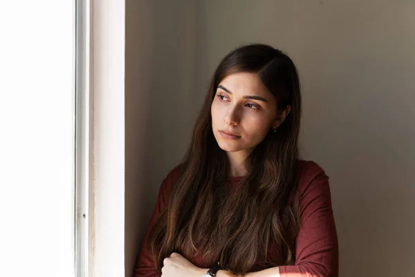 Sad Young Woman Feeling Isolated Lonely Looking Out Her House — Stock fotografie