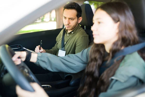 Handsome Male Instructor Checking Testing Driving Skills Teenager Girl Her — Stock Photo, Image