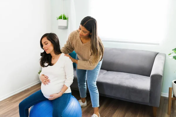 Attractive Expectant Mother Sitting Fitness Ball Living Room Relaxing Back — Fotografia de Stock