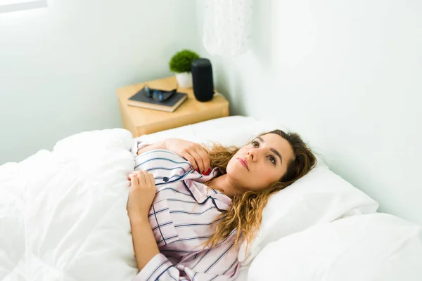 Tired Young Woman Insomnia Lying Bed Covered White Duvet Hispanic — Stock Photo, Image