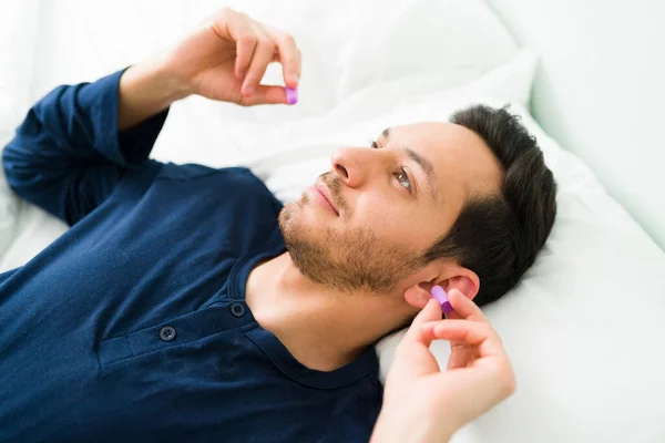 Attractive Man His 30S Putting Earplugs Sleeping Again Because Noisy — Stock Photo, Image