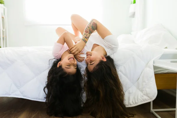 Loving Affectionate Mom Tickling Her Happy Little Daughter While Lying — Stock Photo, Image