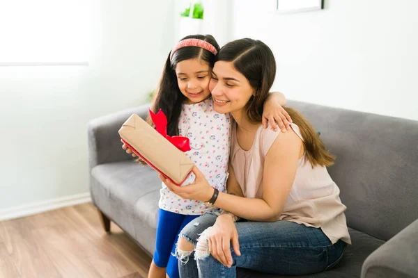 Happy Little Kid Hugging Her Mother While Giving Gift Her — Stock Photo, Image
