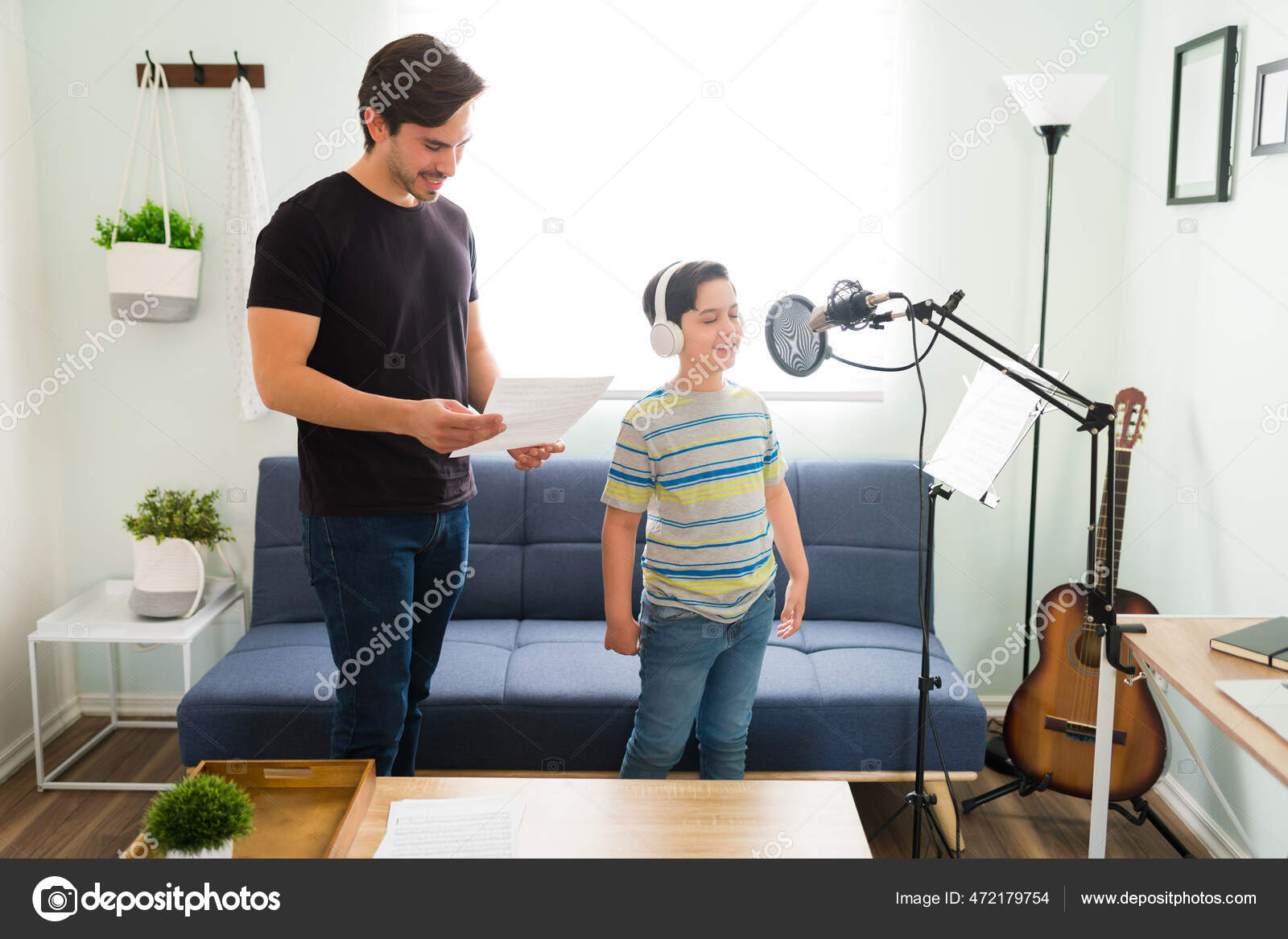 Inspired Elementary Boy Smiling While Singing Beautiful Song Microphone