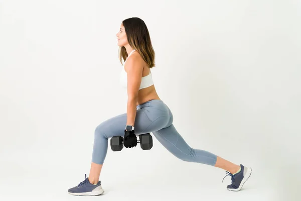 Sporty Young Woman Activewear Doing Lunges While Holding Two Dumbbell — Stock Photo, Image