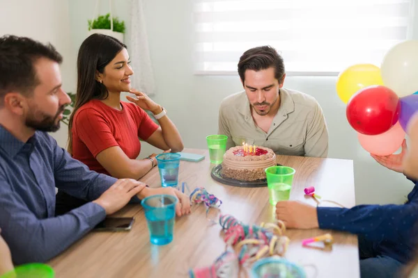 Joven Hispano Soplando Las Velas Pastel Mientras Pide Deseo Cumpleaños —  Fotos de Stock