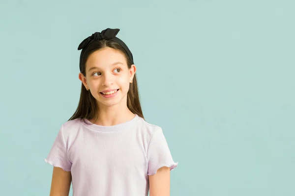 Dreamy Young Girl Smiling While Thinking Happy Thoughts Using Her — Stock Photo, Image