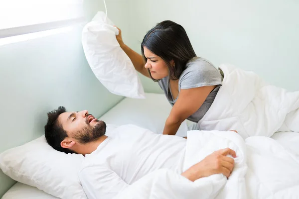 Attractive Hispanic Man Sleeping Snoring While Her Angry Girlfriend Grabs — Stock Photo, Image