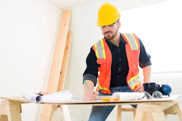 Finishing Last Touches Construction Plans Professional Contractor Helmet Writing Some — Stock Photo, Image