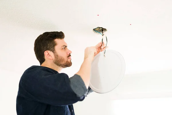 Professional Hispanic Electrician Fixing Electrical System Ceiling Cutting Some Cables — Stock Photo, Image