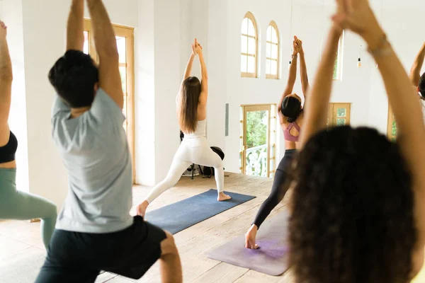 Rear View Group Young People Practicing Warrior Pose Yoga Class — Stock Photo, Image