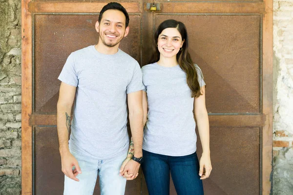 Latin Boyfriend Girlfriend Holding Hands Outdoors Wearing Gray Matching Shirts — Stock Photo, Image