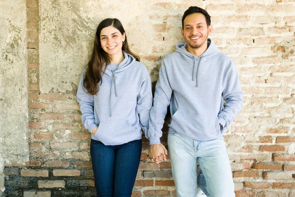 Matching Hoodies Hispanic Boyfriend Girlfriend Holding Hands While Wearing Print — Stock Photo, Image
