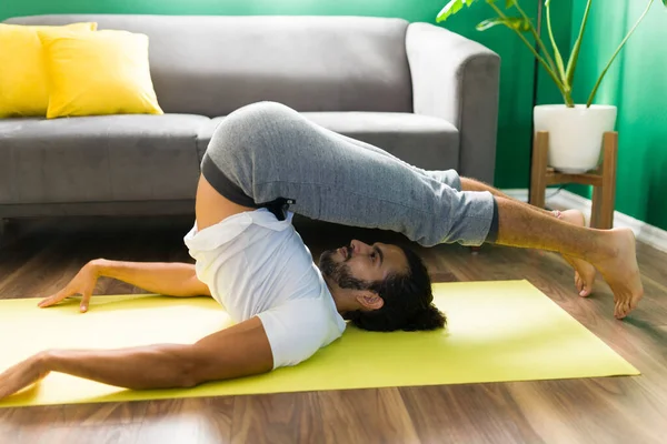 Flexible Young Man Practicing Plow Pose Yoga Mat Latin Man — Stock Photo, Image