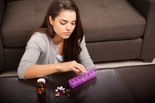 Woman with pill organizer — Stock Photo, Image