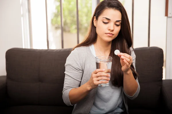 Woman with pill and water glass — Stock Photo, Image