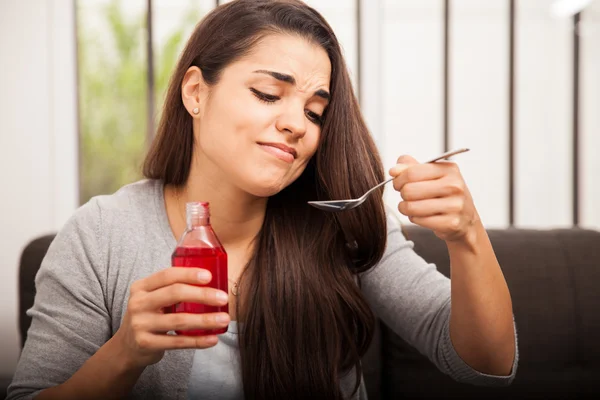 Woman with cough syrup — Stock Photo, Image
