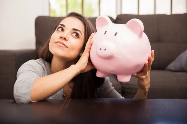 Hispanic woman with piggy bank — Stock Photo, Image