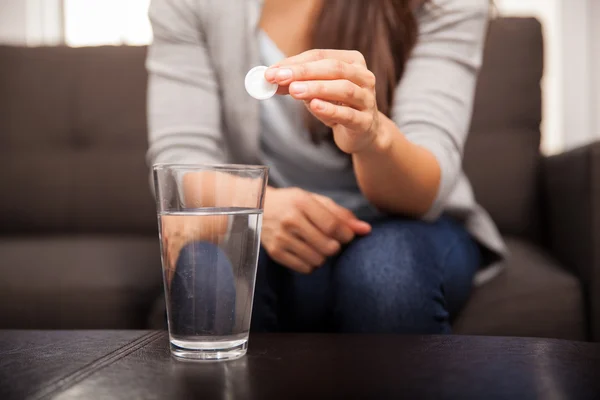 Hands with pill and water glass — Stock Photo, Image