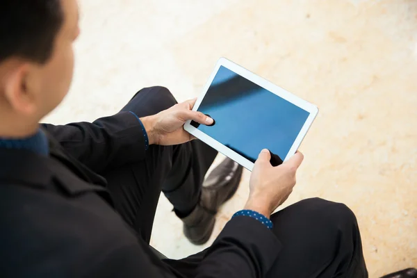 Businessman with tablet computer on bench — Stock Photo, Image